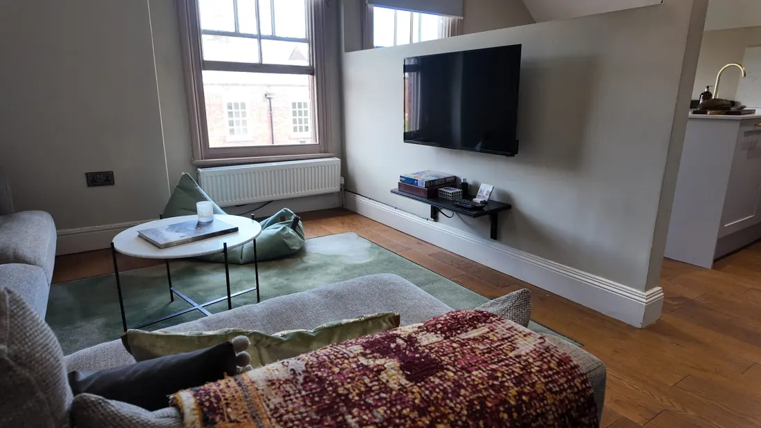 Dachshund Den's lounge with the TV wall
