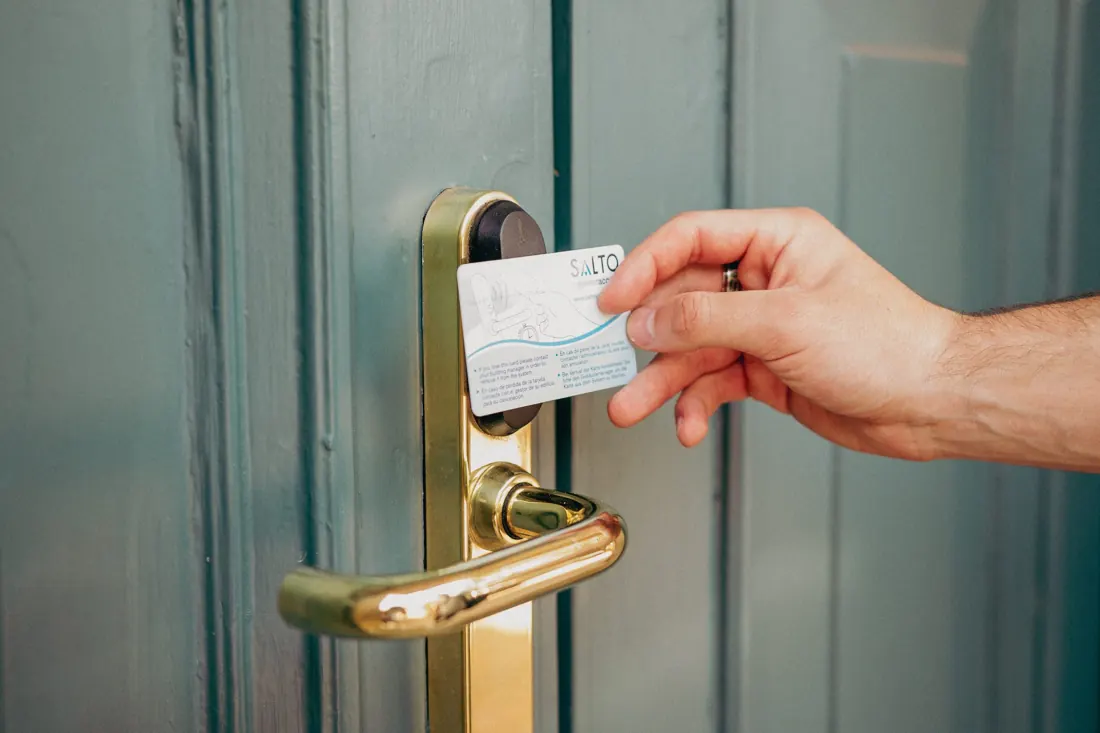 A key card opening the front door